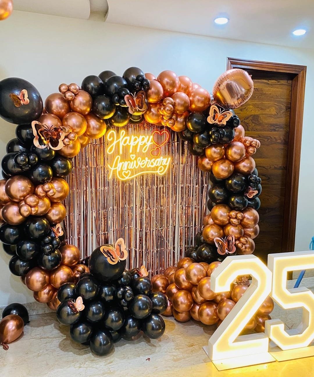 Premium Ring Decoration for anniversary celebrations featuring a stylish ring stand, elegant balloon decoration, Happy Anniversary banner, customized 25 number, and 100 extra balloons for party area decoration. The setup can be fully customized according to your choice of colours, numbers and theme, making it perfect for anniversary celebrations and special occasions in Delhi NCR.